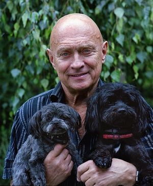 happy senior male with two dogs finding a path to happiness https://greatseniorhealth.com